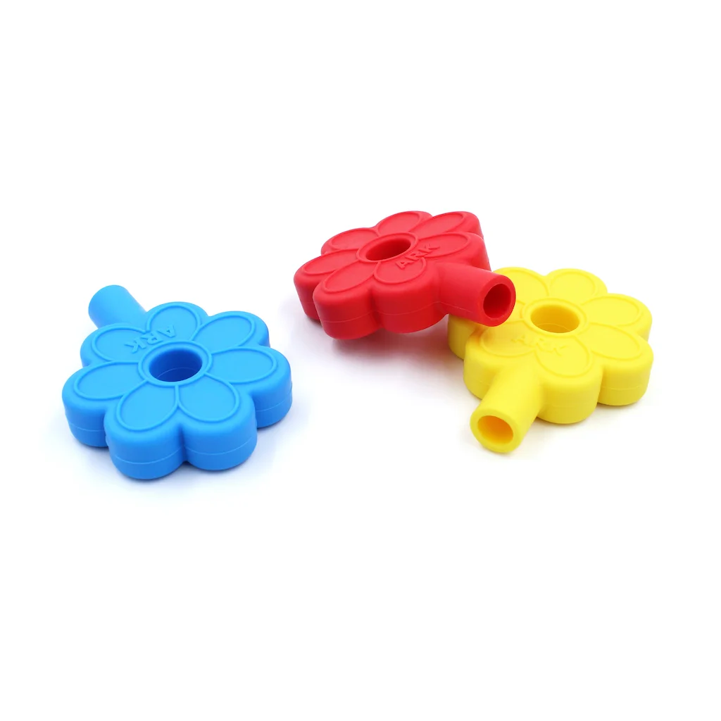 ARK Flower pencil topper – held in child's hand shows kid-friendly size approx 6.3 x 5 x 1.3 cm
