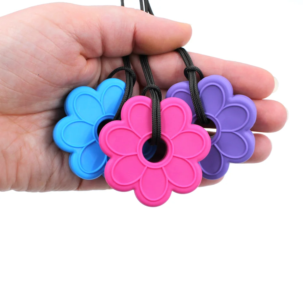 ARK flower chew necklace worn by child safe chew necklace for everyday and school alternative to pacifier or thumb sucking supports focus