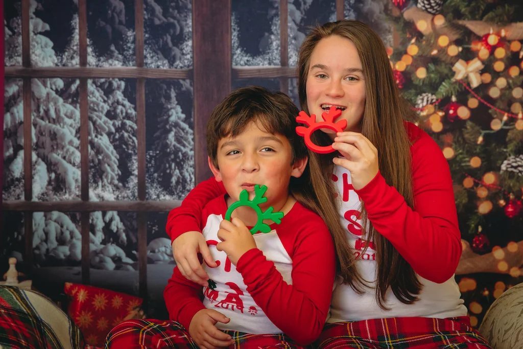ARK Reindeer Chew – shown in baby’s hand, easy-to-hold ring design