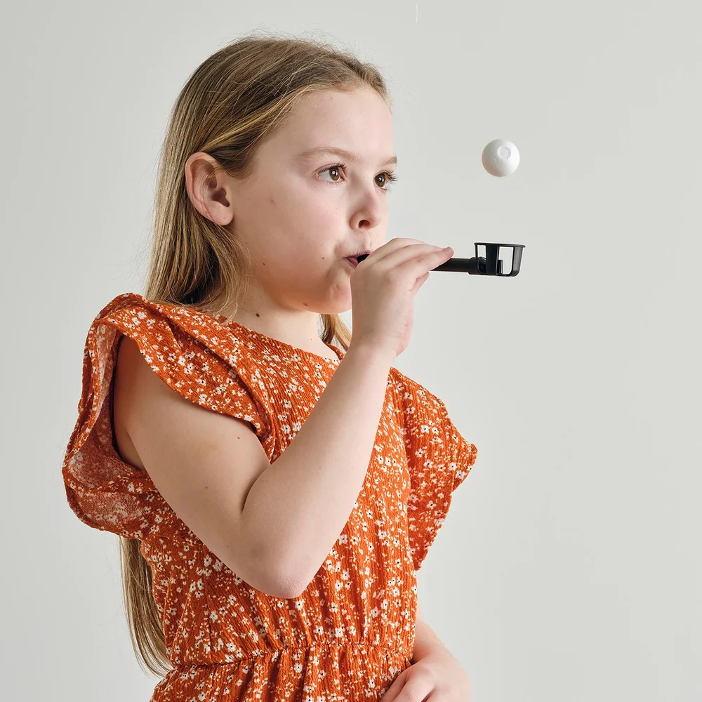Child using the Flow-Ball ULTRA® breathing trainer
